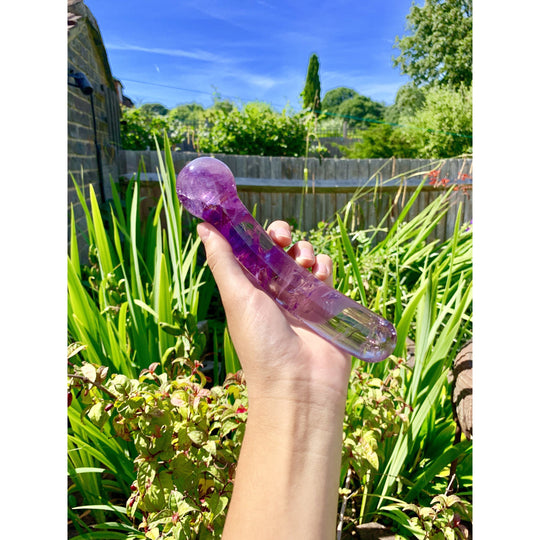 girl holding amethyst massage yoni wand